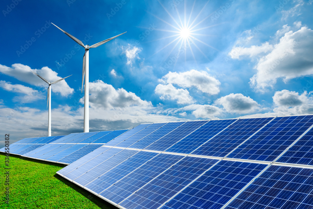 Solar panels with wind turbines on a sunny day,green clean energy concept.