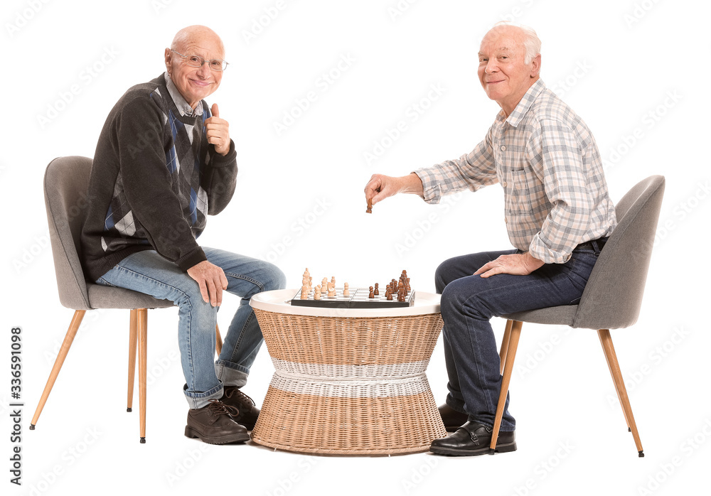 Portrait of elderly men playing chess on white background