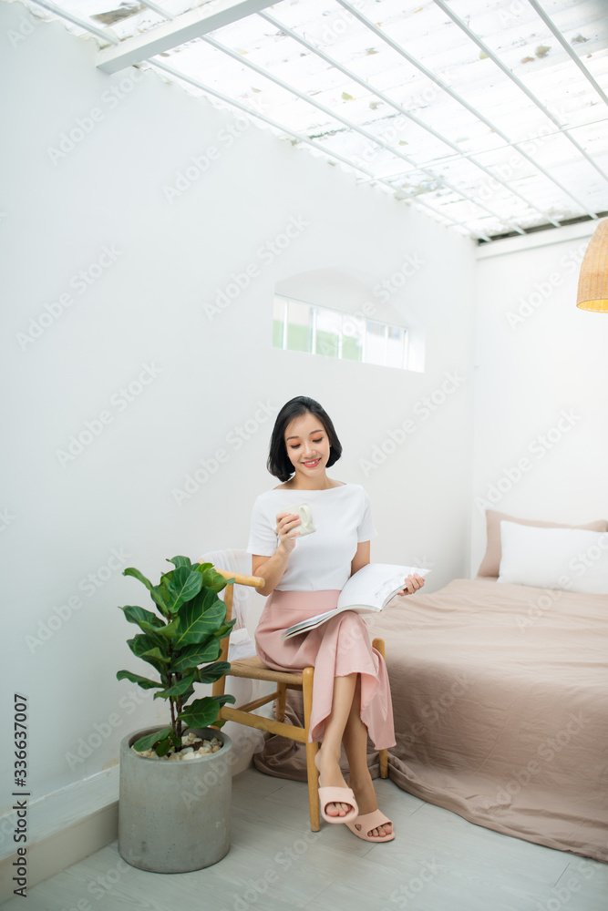 Young woman chilling at home in chair