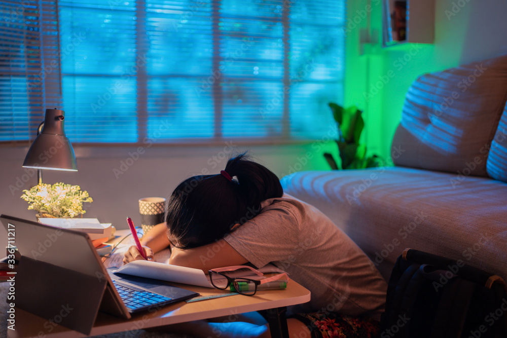 Asian women tired from working at home She felt sleepy