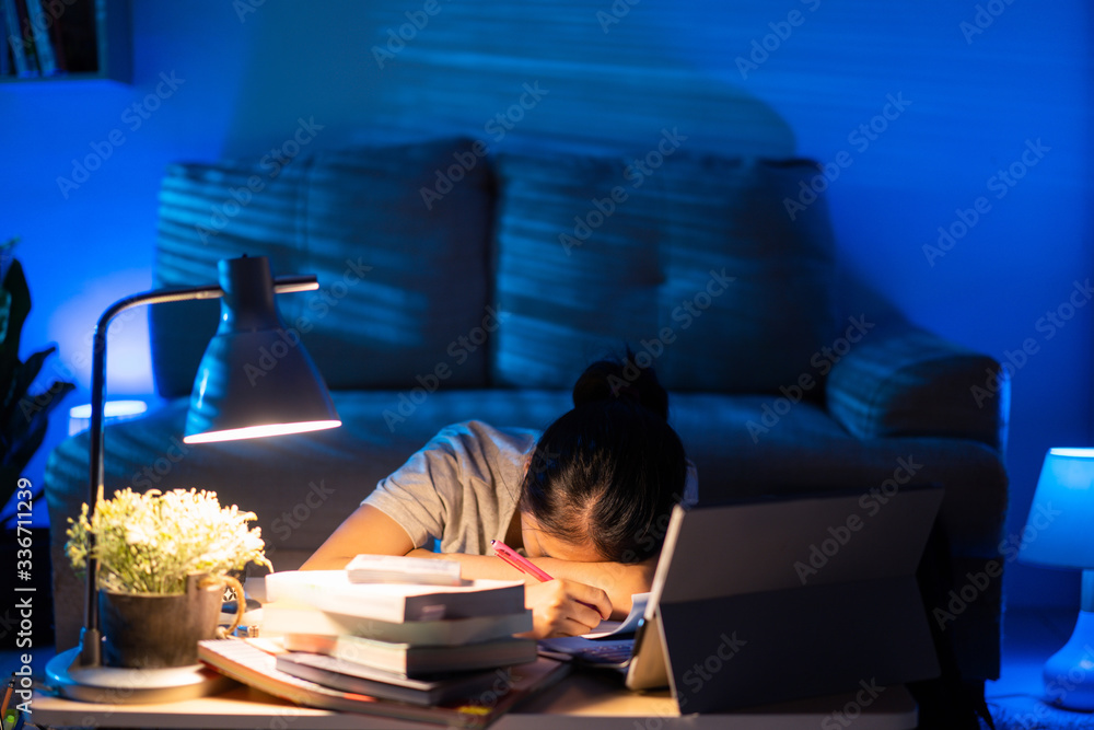 Asian women tired from working at home She felt sleepy