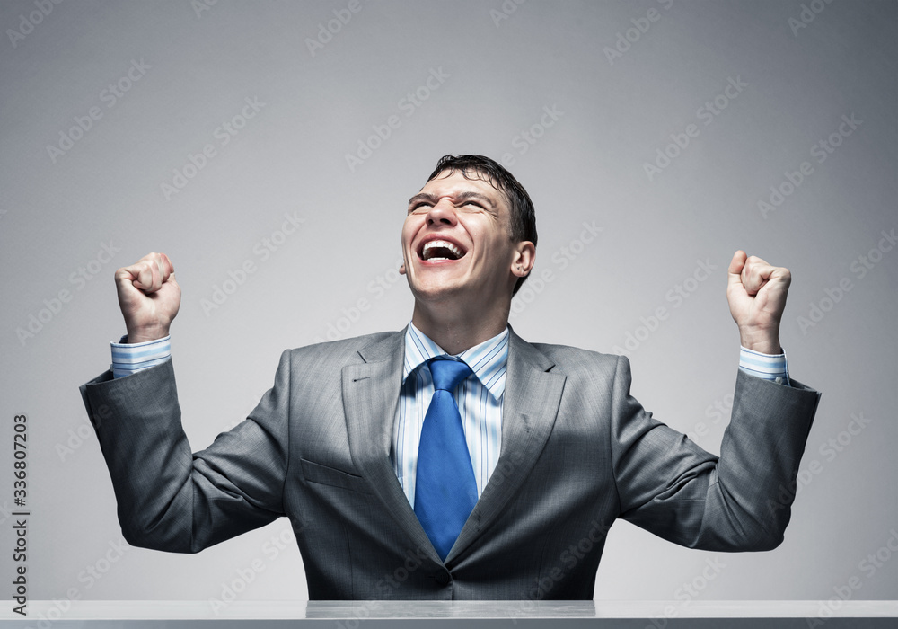 Happy excited businessman celebrating victory