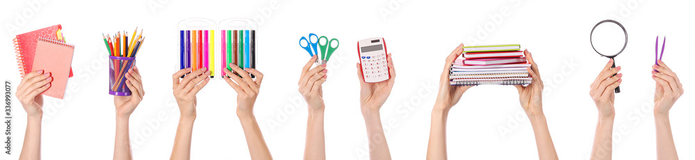 Many hands with school supplies on white background