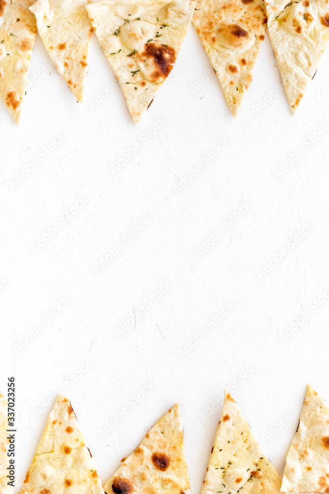 Focaccia pieces frame on white background自顶向下的复制空间