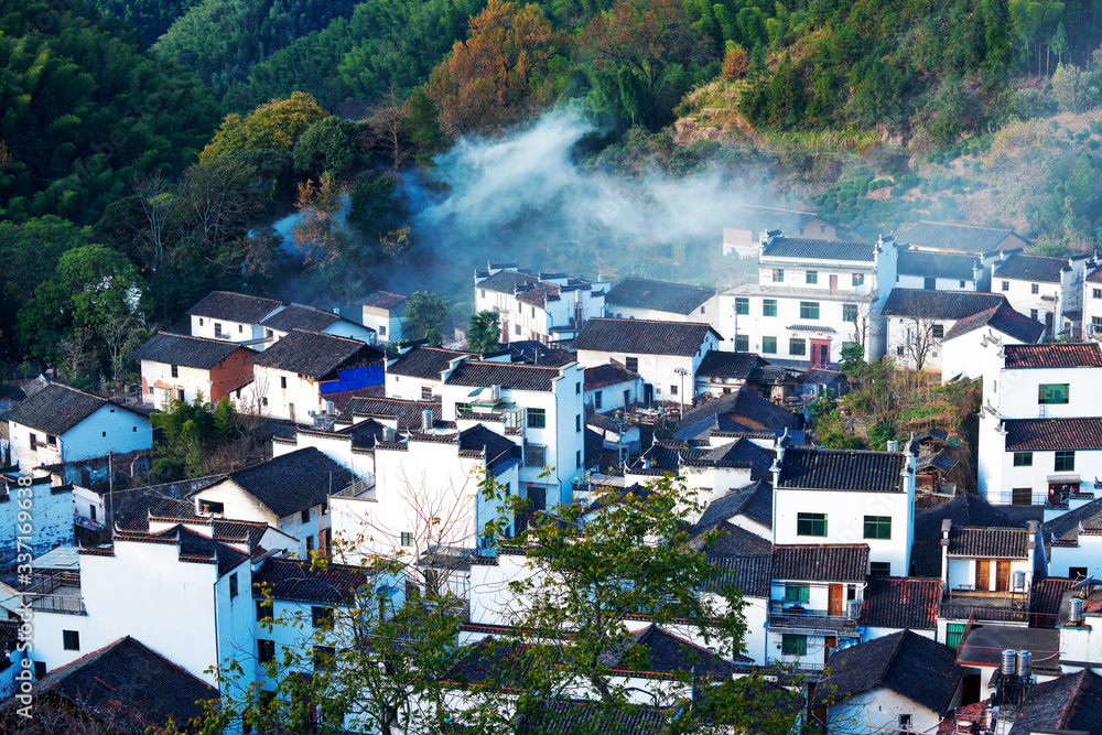 The morning fog on the dwellings of Anhui buildings in Wuyuan county Jiangxi province, China.