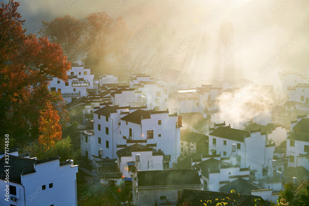 The morning fog on the dwellings of Anhui buildings in Wuyuan county Jiangxi province, China.