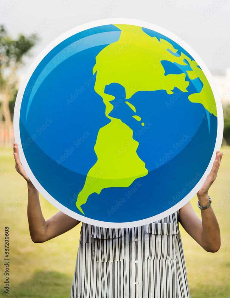 Woman holding a globe in our hands