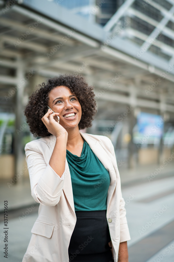 Happy businesswoman talking on the phone