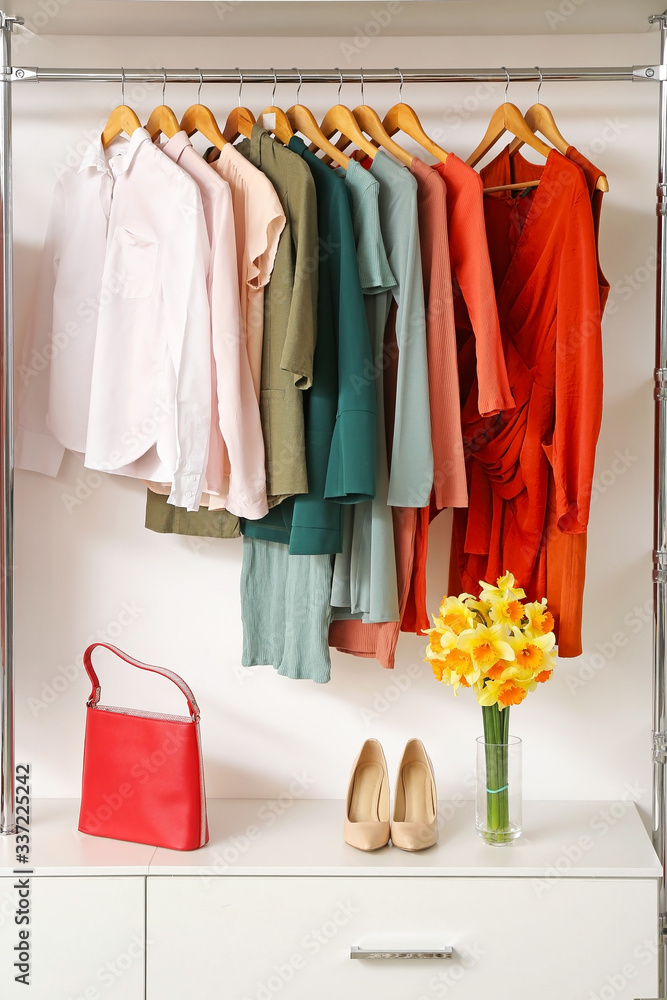 Modern wardrobe with stylish spring clothes and accessories