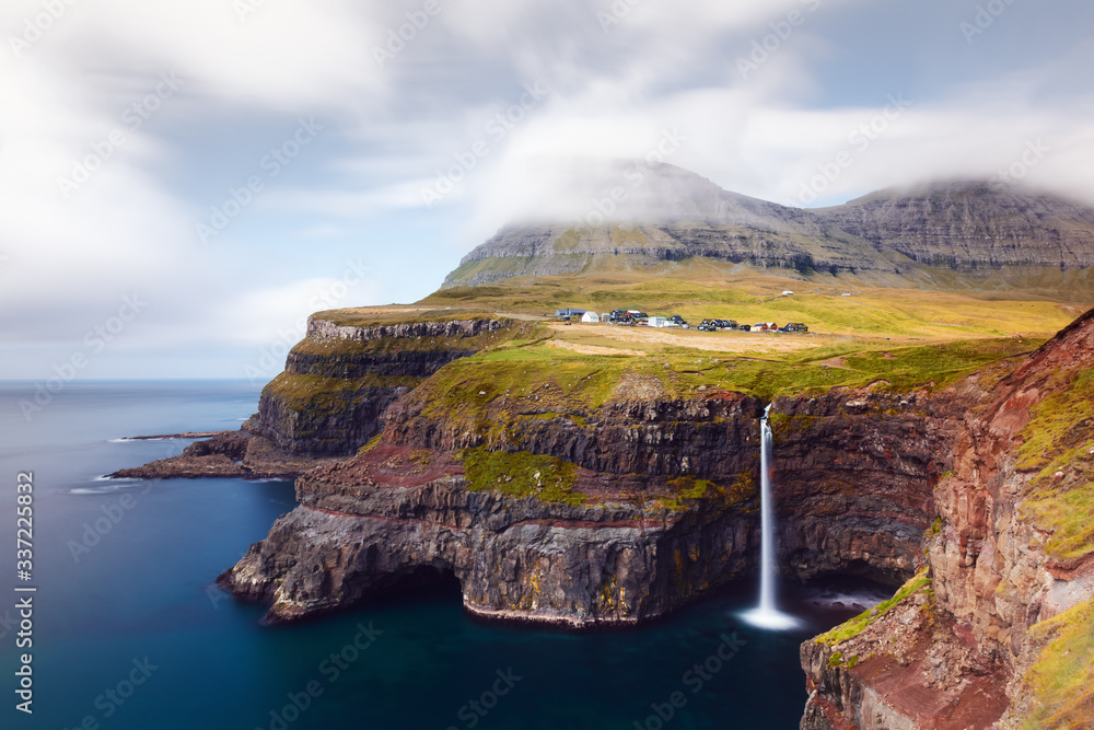 Incredible autumn view of Mulafossur waterfall in Gasadalur village, Vagar Island of the Faroe Islan