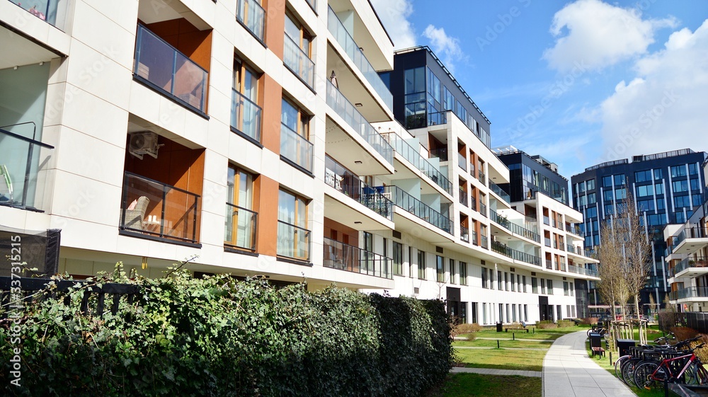 Multistory new modern apartment building. Stylish living block of flats.