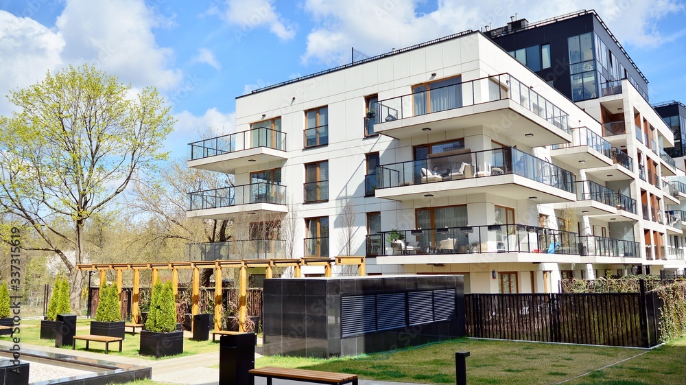 Multistory new modern apartment building. Stylish living block of flats.