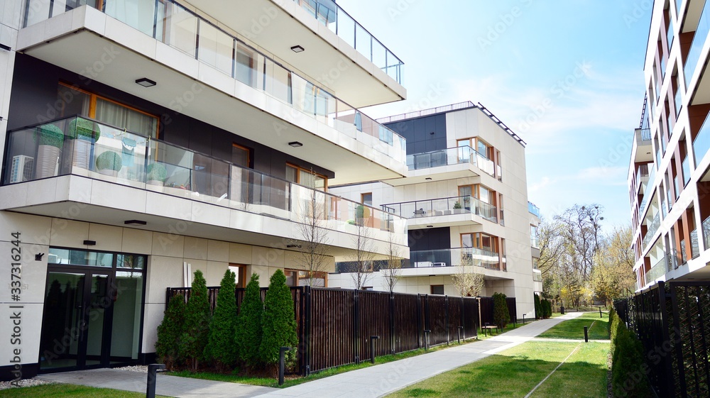 Multistory new modern apartment building. Stylish living block of flats.