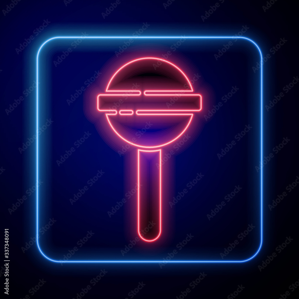 Glowing neon Lollipop icon isolated on blue background. Food, delicious symbol. Vector Illustration