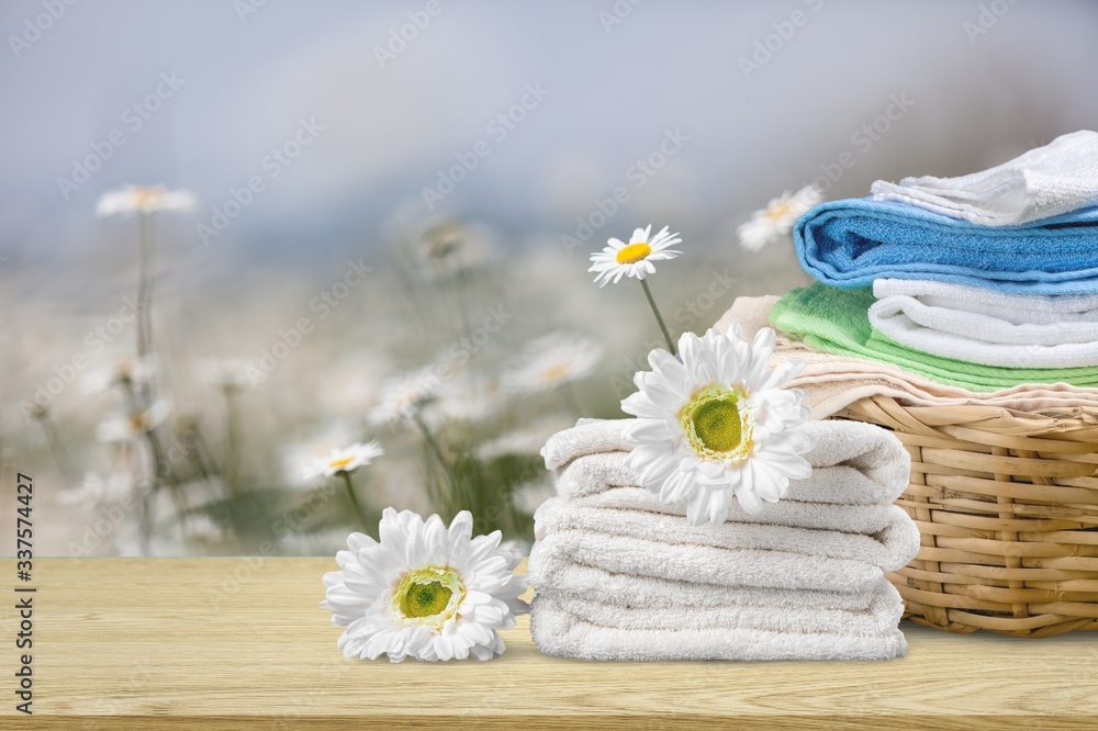 Laundry basket with colorful towels on desk