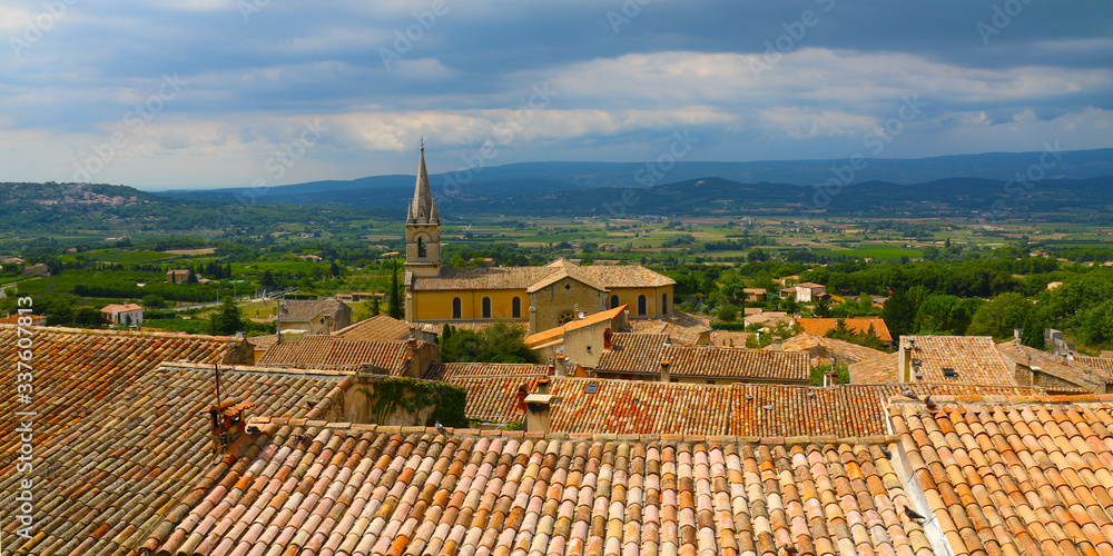 church in the middle of mediterranean village in the south of france	
