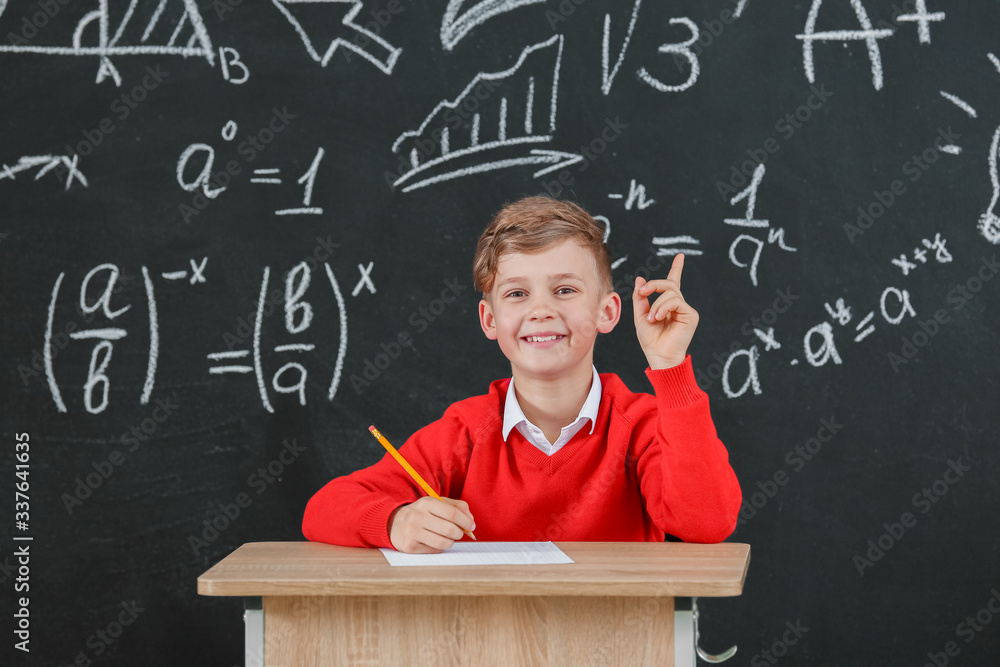 Pupil passing exam at school