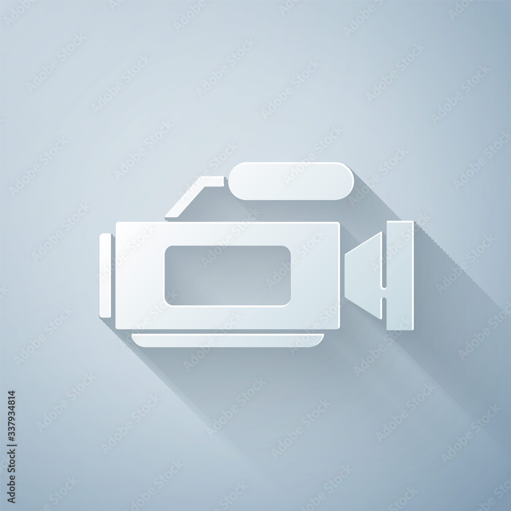 Paper cut Cinema camera icon isolated on grey background. Video camera. Movie sign. Film projector. 