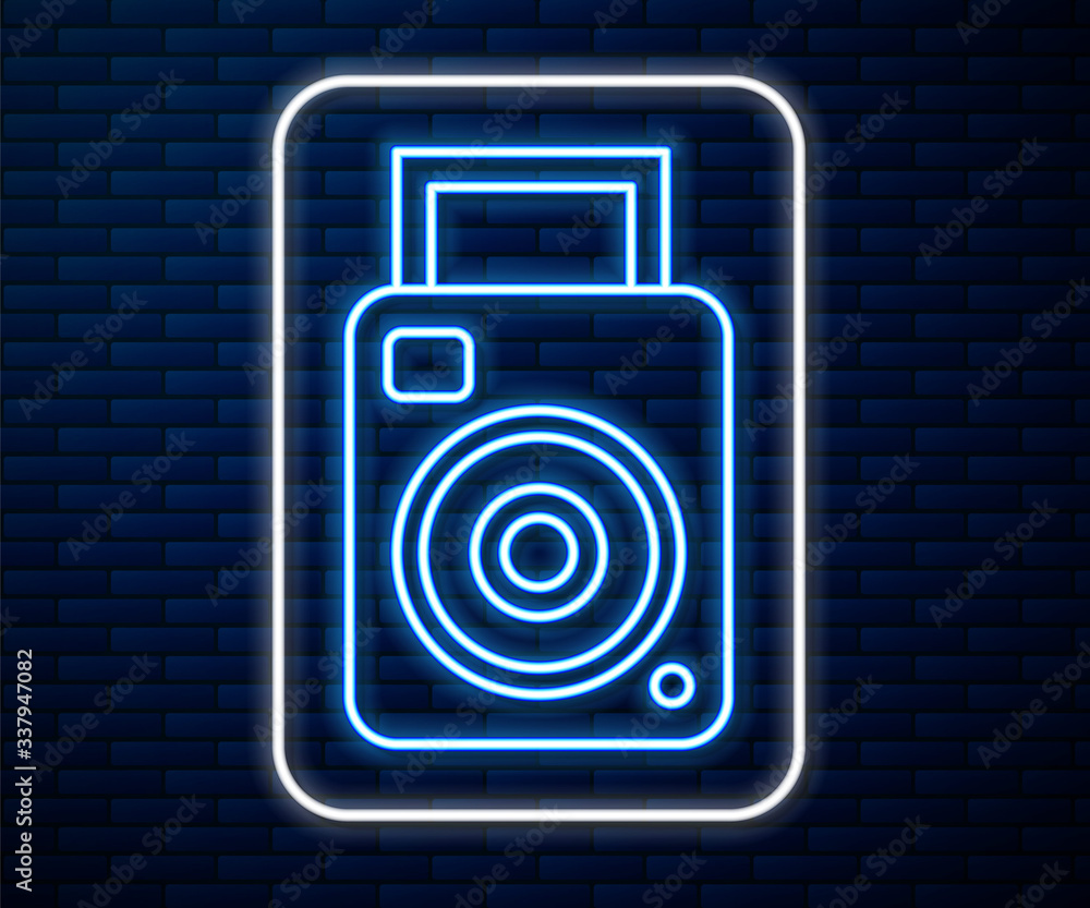 Glowing neon line Photo camera icon isolated on brick wall background. Foto camera icon. Vector Illu