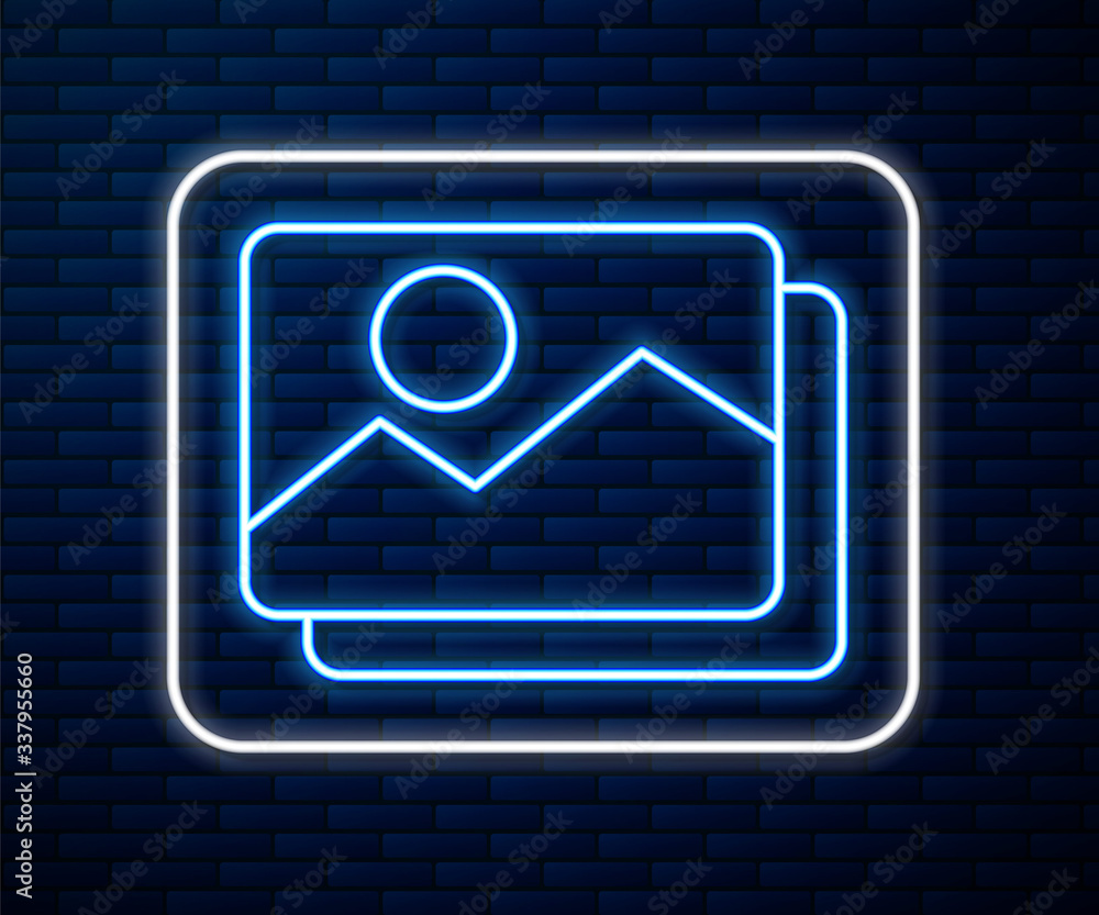 Glowing neon line Picture landscape icon isolated on brick wall background. Vector Illustration