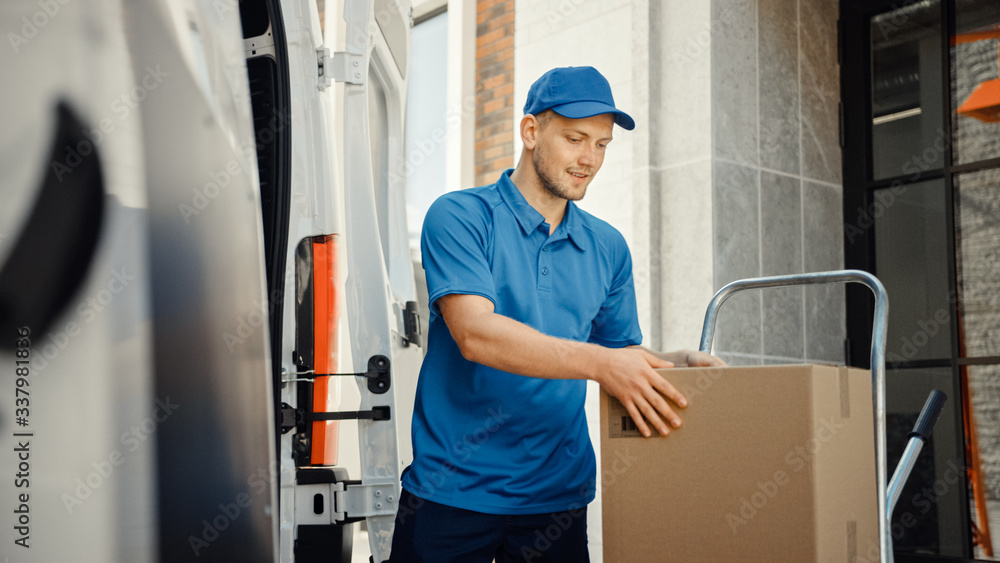 Delivery Man Uses Hand Truck Trolley Full of Cardboard Boxes and Packages, Loads Parcels into Truck 