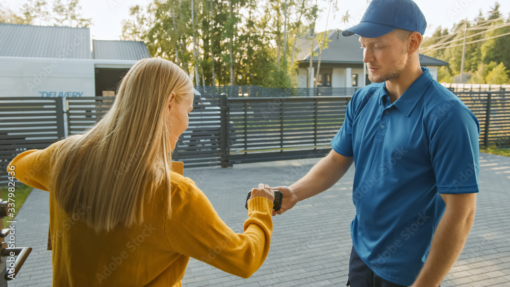 Beautiful Young Woman Meets Delivery Man who Gives Her Cardboard Box Package, She Signs Electronic S