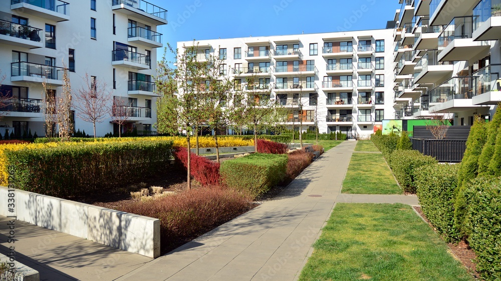 Contemporary residential building exterior in the daylight. Modern apartment buildings on a sunny da