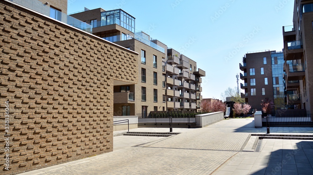 Contemporary residential building exterior in the daylight. Modern apartment buildings on a sunny da