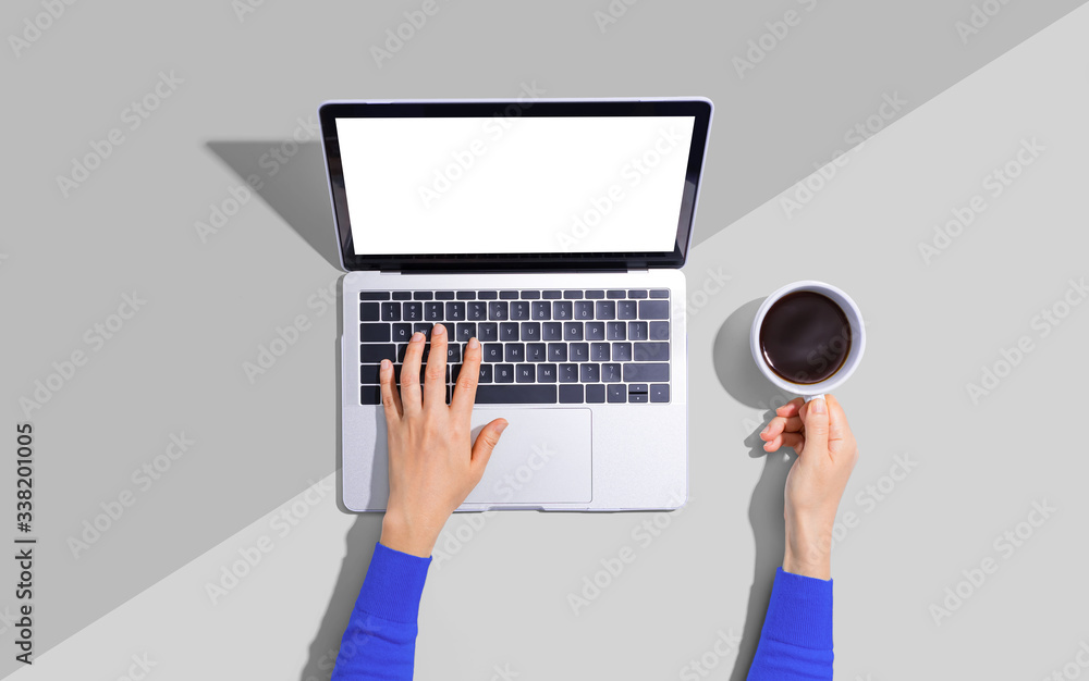 Person using a laptop computer from above