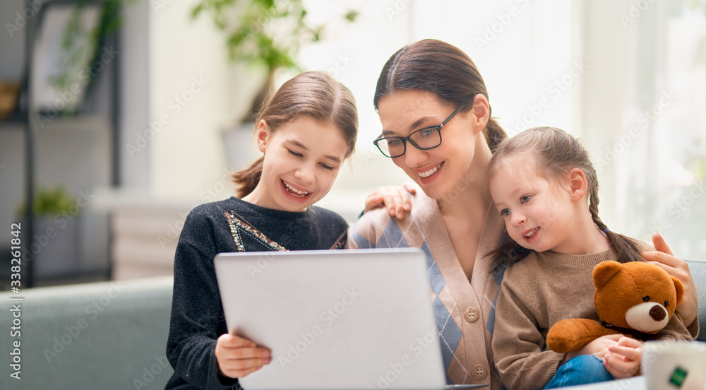 mother and children using a computer