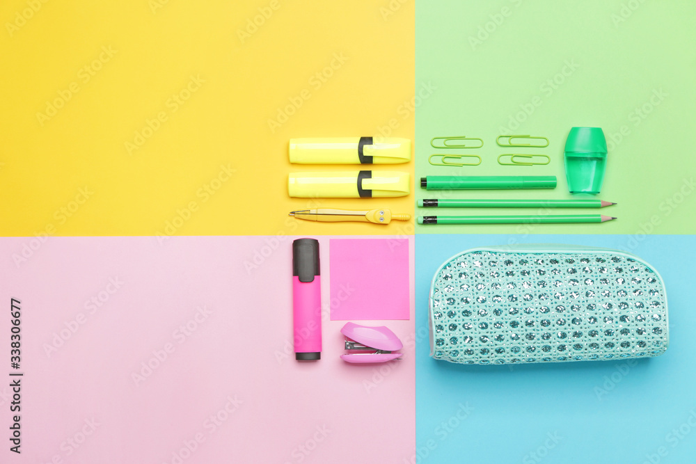 Pencil bag with stationery on color background