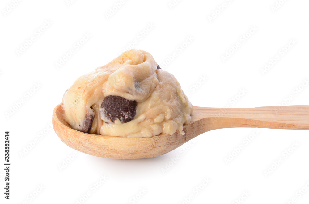 Spoon with sweet dough on white background