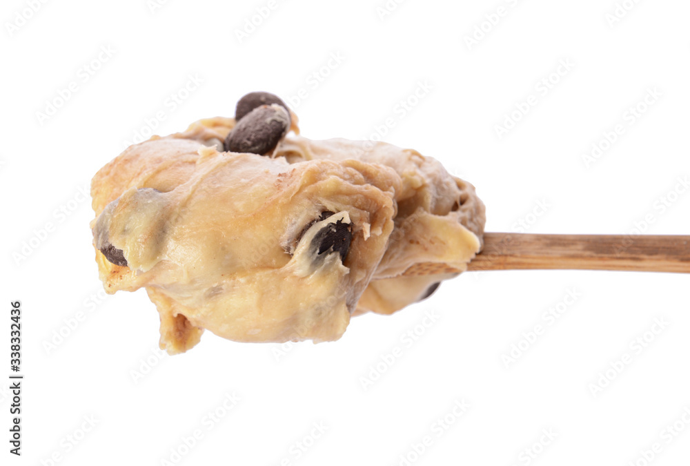 Spoon with sweet dough on white background