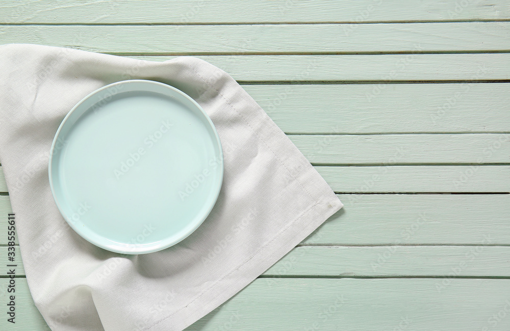 Clean plate on wooden background