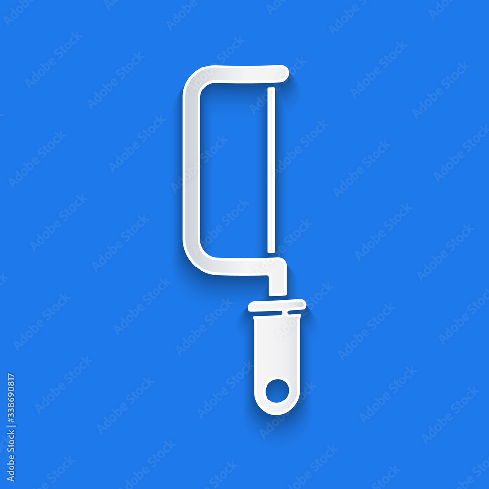 Paper cut Hacksaw icon isolated on blue background. Metal saw for wood and metal. Paper art style. V