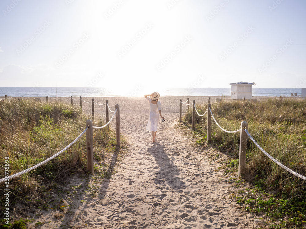 Walking girl on the beach