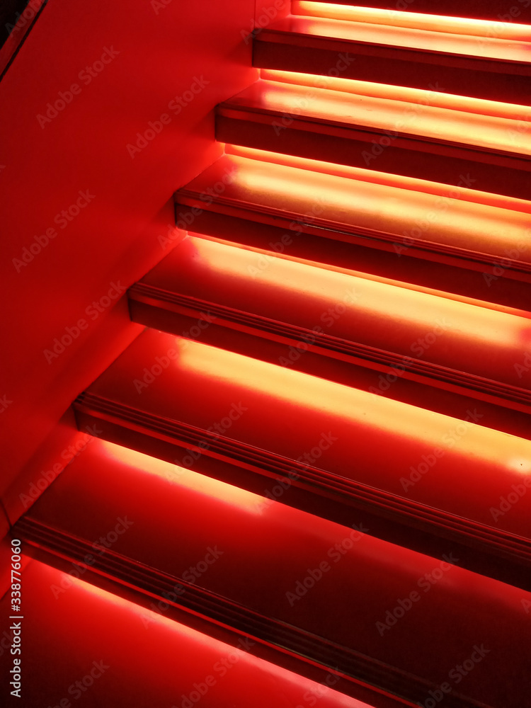 Red illuminated stairs indoors