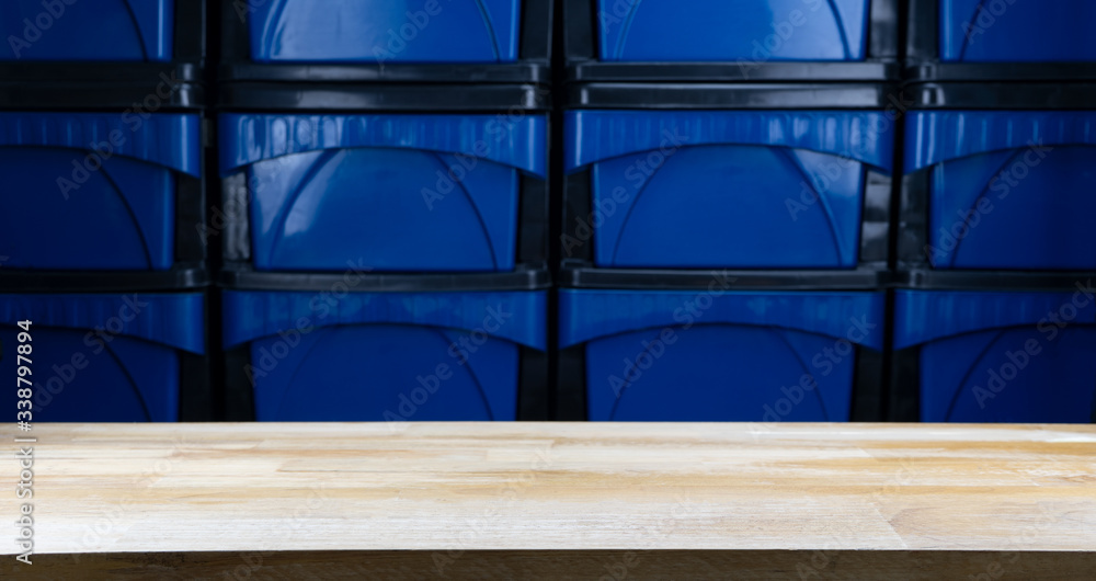 Empty wooden floor table with blurred background.