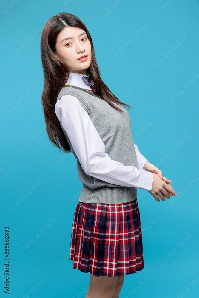 Asian schoolgirls on blue background