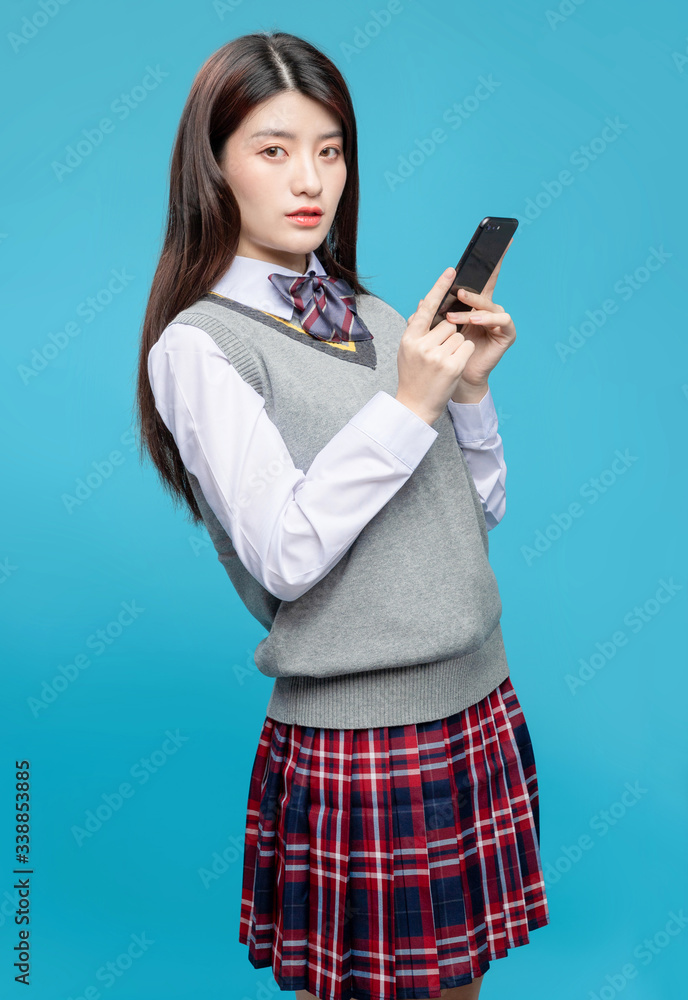 Asian schoolgirls on blue background