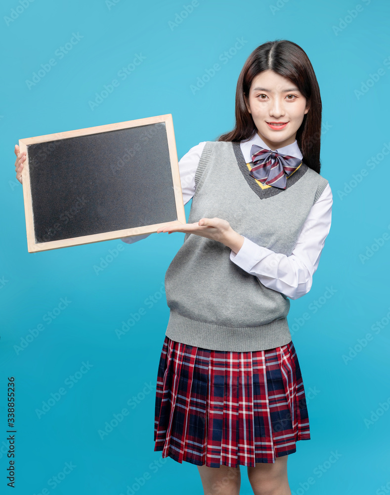 Asian schoolgirls on blue background