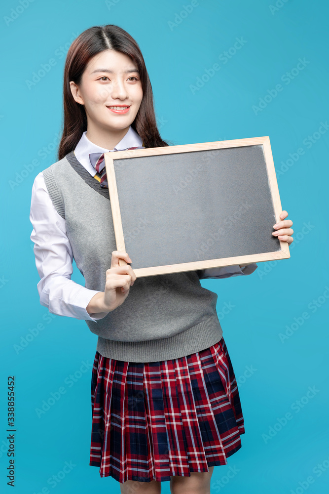 Asian schoolgirls on blue background