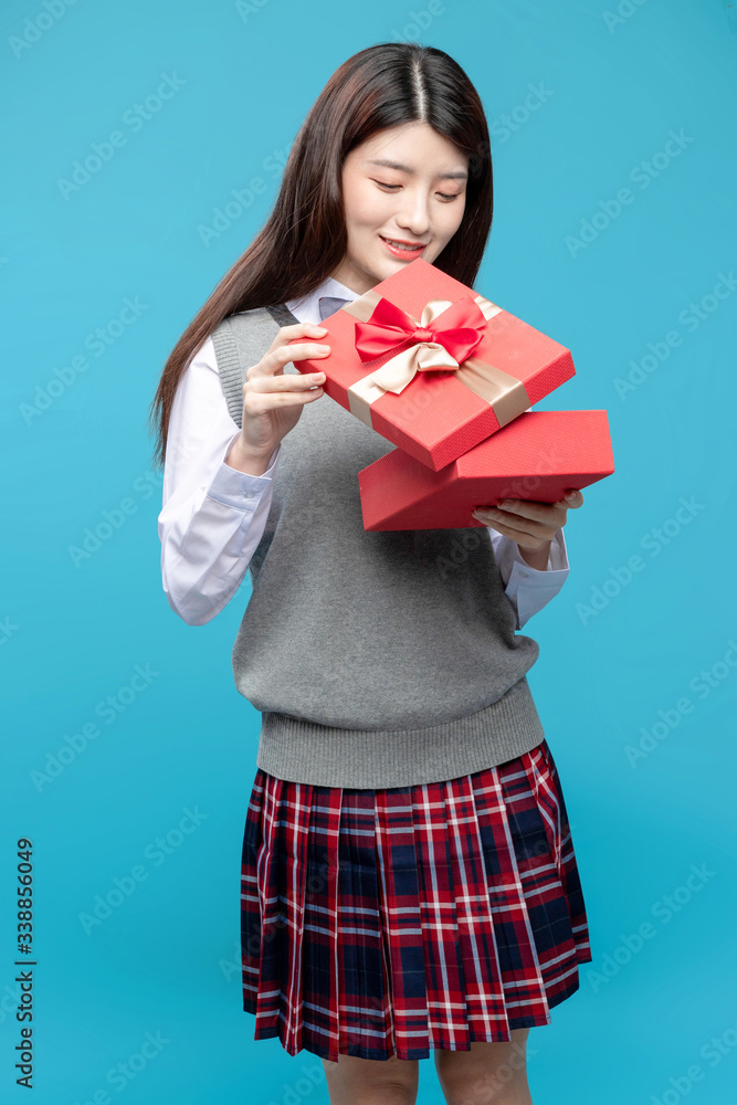 Asian schoolgirls on blue background