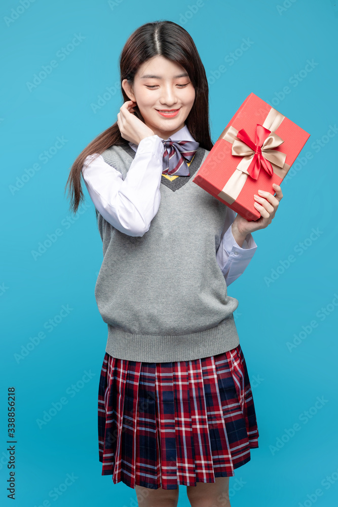 Asian schoolgirls on blue background