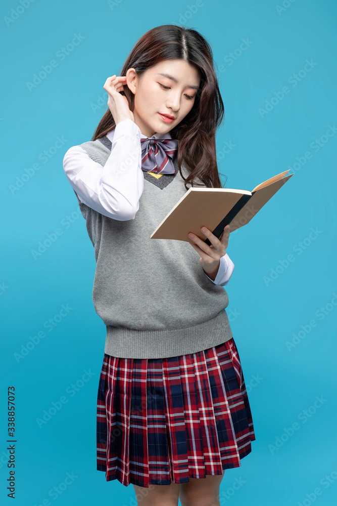 Asian schoolgirls on blue background