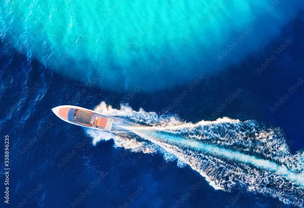 Croatian seascape with boat. Yachts at the sea surface. Aerial view of luxury floating boat on blue 