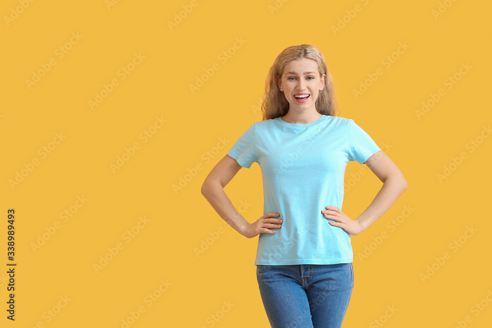 Woman in stylish t-shirt on color background