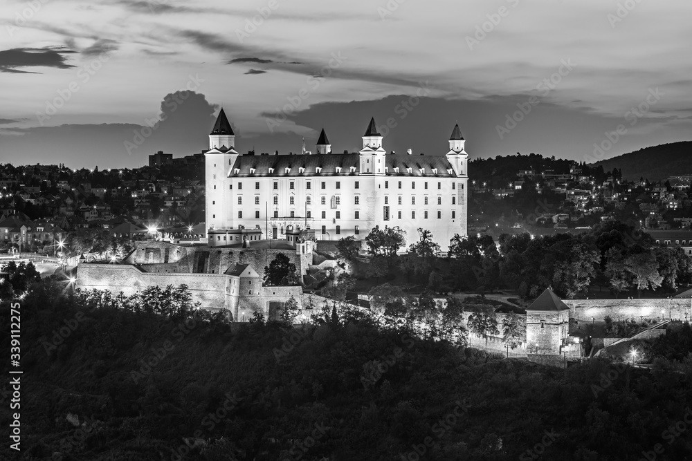 Bratislava castle over Danube river after sunset in the Bratislava old town, Slovakia