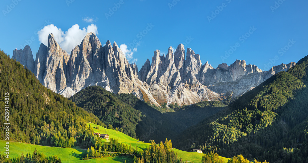 Famous alpine place  Santa Maddalena village with magical Dolomites mountains in background, Val di 