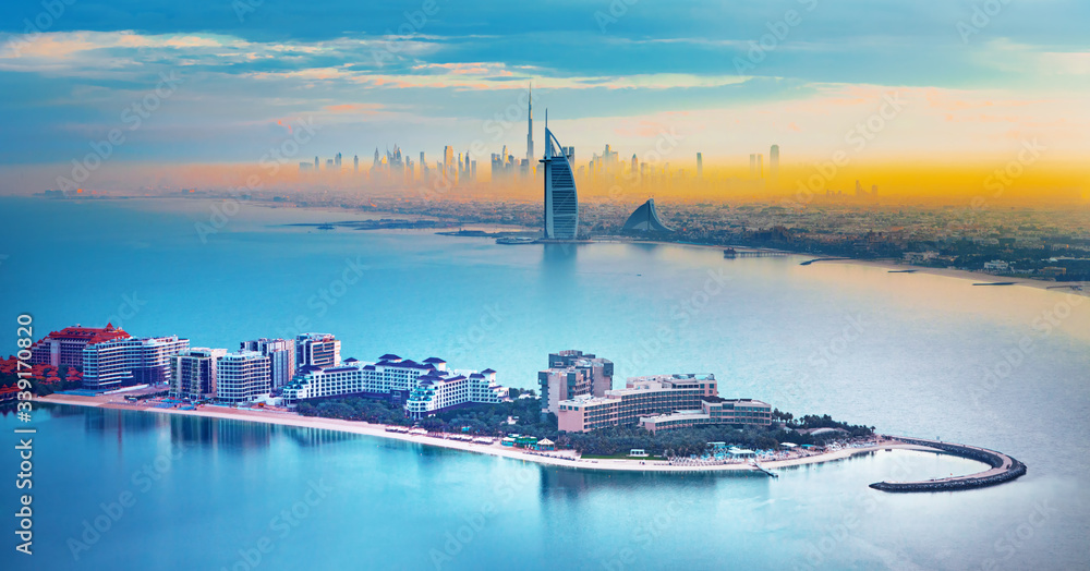 Dubai city center and famous Jumeirah beach skyline at sunset, United Arab Emirates